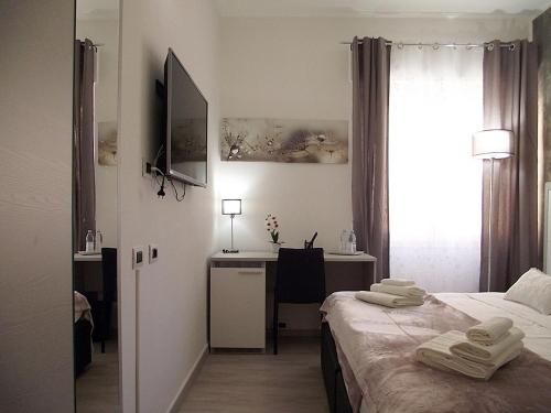 Ένα ή περισσότερα κρεβάτια σε δωμάτιο στο La casa di Atena