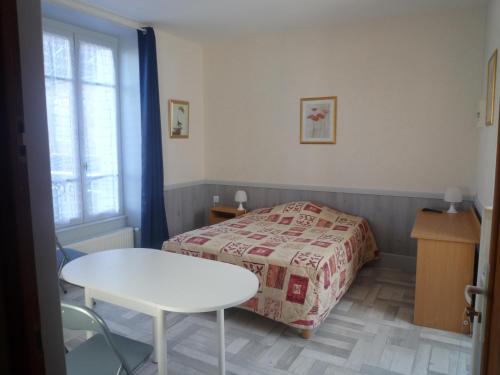 Postel nebo postele na pokoji v ubytování Au Relais du Parc de Millevaches