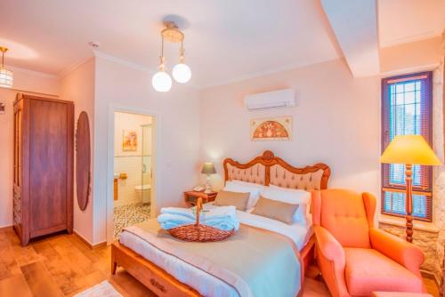 a bedroom with a bed and a couch and a chair at Villa TN - Fethiye in Fethiye