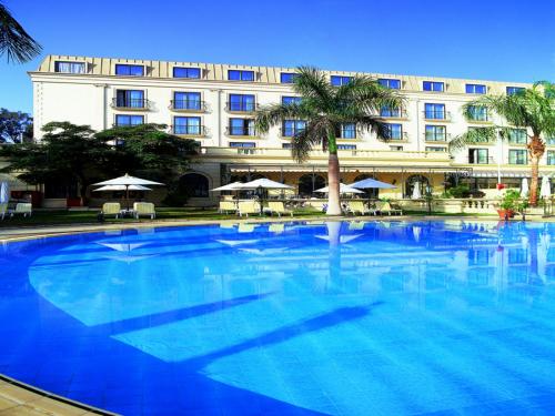 a large swimming pool in a large building at Concorde El Salam Cairo Hotel & Casino in Cairo