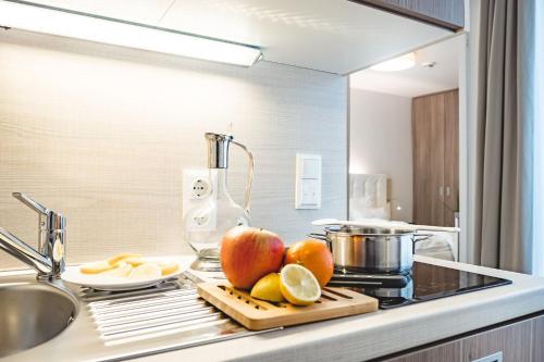 Oliver Apartments | contactless check-inにあるキッチンまたは簡易キッチン