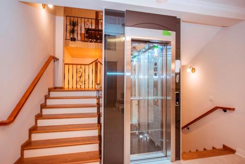 a staircase with a glass door in a house at Villa TN - Fethiye in Fethiye