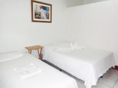 Un pat sau paturi într-o cameră la Hospedaje y Cafe Ruiz