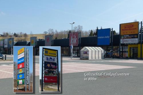 a group of signs in front of a parking lot at Ferienwohnung KaRo in Ellefeld