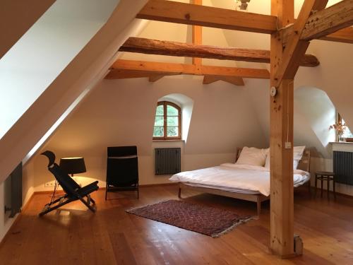 a bedroom with a bed in a attic at Dichterhaus Dresden in Dresden