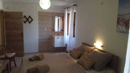 Ένα ή περισσότερα κρεβάτια σε δωμάτιο στο Paradise apartment - Old town Rab