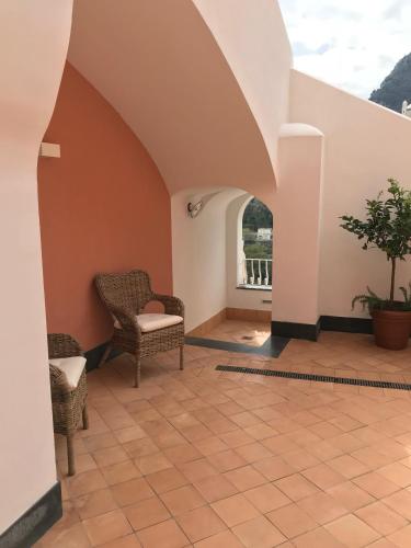 a living room with chairs and a table at Il Moro Di Positano in Positano