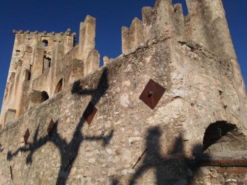 a shadow of a building with a tower at B&B Medole in Medole