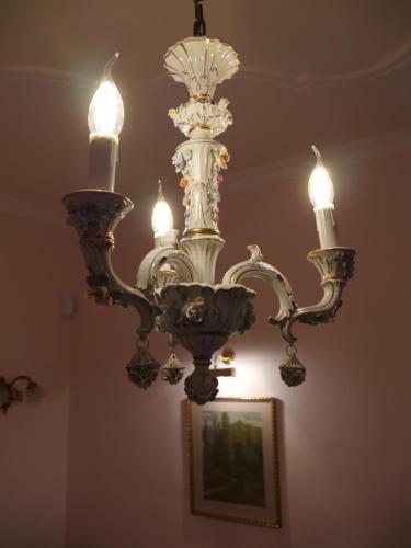 a chandelier hanging from a ceiling in a room at Schloss Gmünd in Gmünd