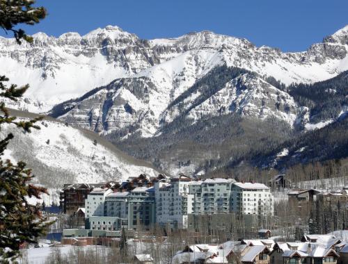 a building in front of a snowy mountain at The Peaks Resort and Spa in Telluride