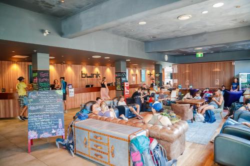 a group of people sitting on couches in a room at Bunk Brisbane in Brisbane