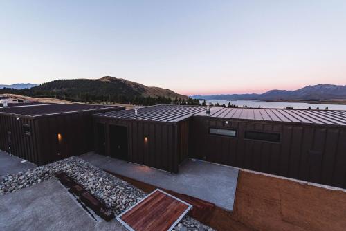 a building with solar panels on top of it at The View Lake Tekapo in Lake Tekapo