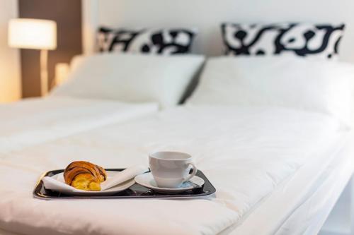 Postelja oz. postelje v sobi nastanitve Priuli Luxury Rooms