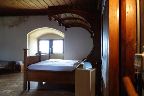 a bedroom with a bed with a large mirror at Castel Pergine in Pergine Valsugana