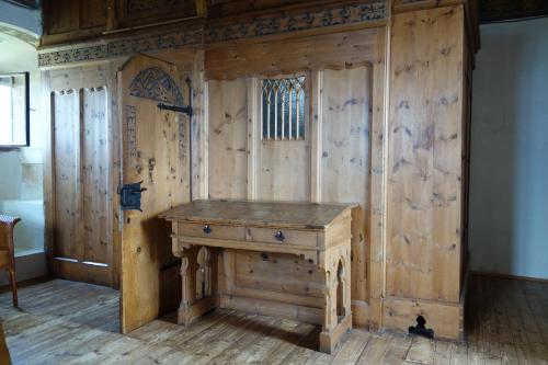 a wooden room with a wooden desk in it at Castel Pergine in Pergine Valsugana