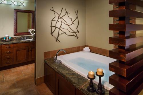 a bathroom with a large tub and a sink at Hyatt Vacation Club at Pinon Pointe, Sedona in Sedona
