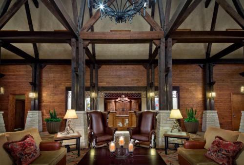 a lobby with leather chairs and a chandelier at Hyatt Vacation Club at Wild Oak Ranch in San Antonio