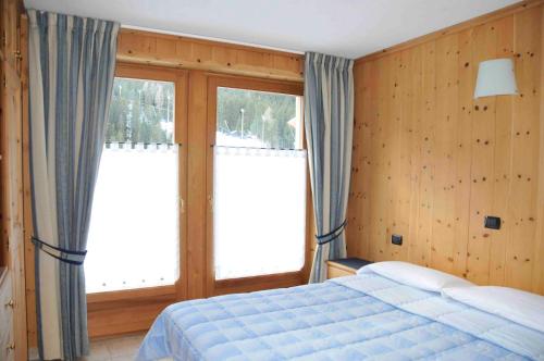 Postel nebo postele na pokoji v ubytování Chalet Le Betulle