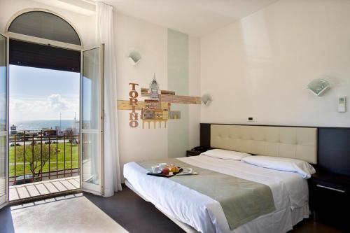 Cama o camas de una habitación en Dipendenza Hotel Bellavista