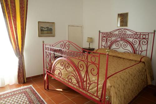Postel nebo postele na pokoji v ubytování Palazzo Pulieri