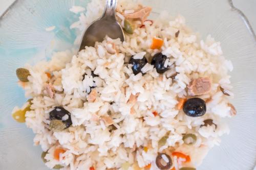 a bowl of rice with a spoon in it at Hotel Barbiani in Rimini