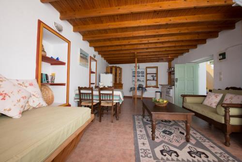 a living room with a couch and a table at Villa Petros in Symi