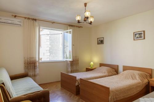 Postel nebo postele na pokoji v ubytování Apartman Željka