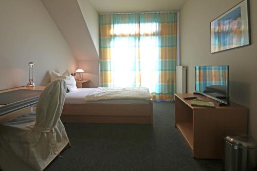 Ένα ή περισσότερα κρεβάτια σε δωμάτιο στο Hotel Busch-Atter