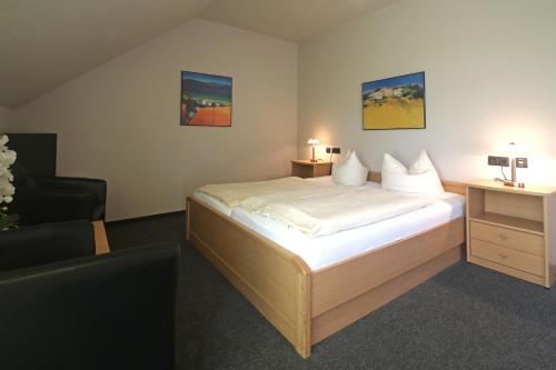 Postel nebo postele na pokoji v ubytování Hotel Busch-Atter