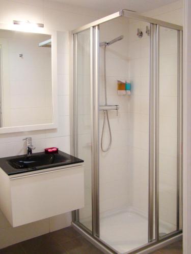 a bathroom with a shower and a sink at Bekale in Ea