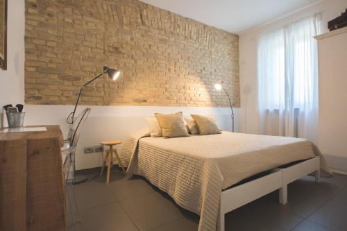 Ένα ή περισσότερα κρεβάτια σε δωμάτιο στο Bed and breakfast Aratro & Rosmarino