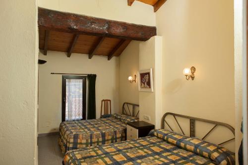 Tempat tidur dalam kamar di Can Pau