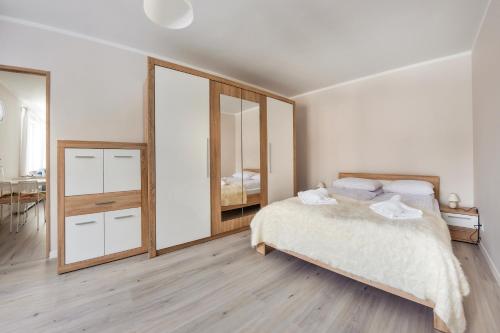 เตียงในห้องที่ Apartamenty Sun & Snow Szkolna