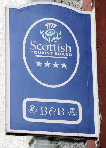 a sign for a scottish tourist board on a building at Douglas House in Castle Douglas
