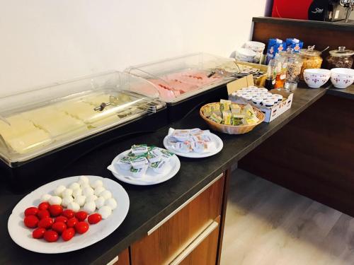 a buffet with plates of food on a counter at Pension Babenberger in Melk