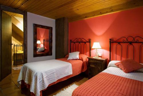 מיטה או מיטות בחדר ב-Casa Rural Quilero