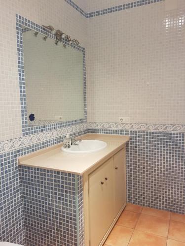 a bathroom with a sink and a mirror at Mar in Isla del Moral
