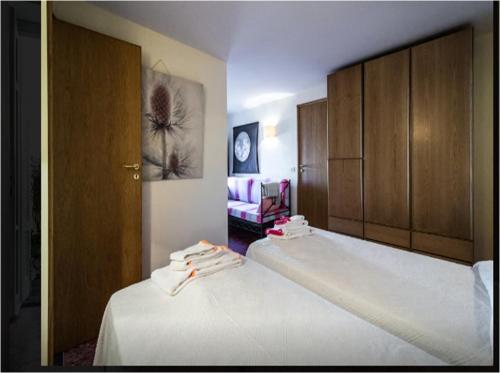 Ένα ή περισσότερα κρεβάτια σε δωμάτιο στο Le Camerelle 83