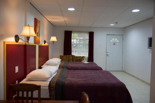 Postel nebo postele na pokoji v ubytování Hotel North Resort