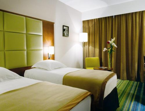 Postel nebo postele na pokoji v ubytování New Hotel Charlemagne