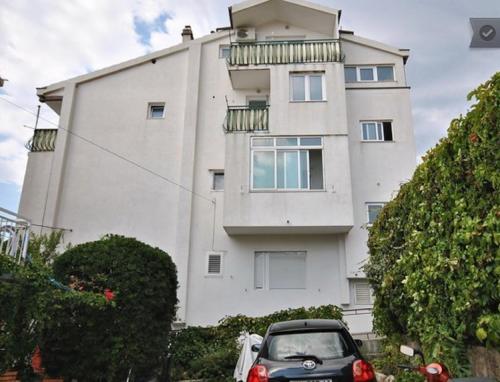 a car parked in front of a building at The best location in Makarska,free P, option bikes in Makarska