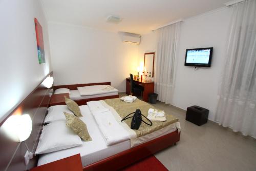 Postel nebo postele na pokoji v ubytování Guesthouse Villa Inn