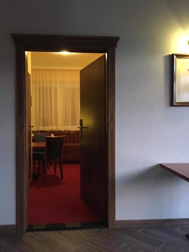 a door leading into a dining room with a table at Virgo B&B Biznes Rumia in Rumia