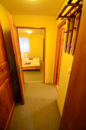 a hallway with a room with a bed in it at Salas-Partizanske in Partizánske