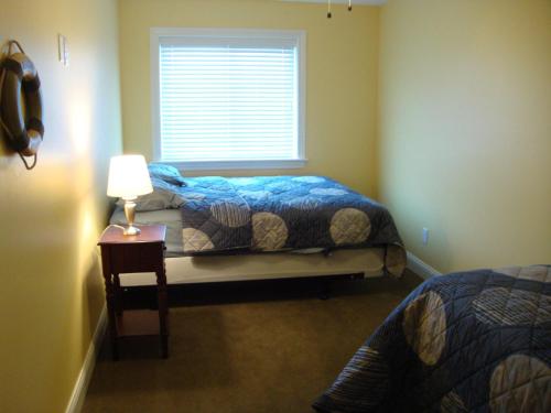 A bed or beds in a room at Put-in-Bay Waterfront Condo #210