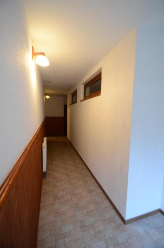 an empty hallway in a building with a hallway at Salas-Partizanske in Partizánske