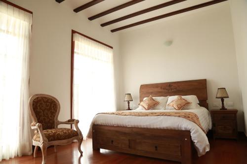 A bed or beds in a room at Hotel Boutique El Libertador