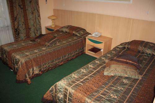 Ένα ή περισσότερα κρεβάτια σε δωμάτιο στο Berkana Hotel