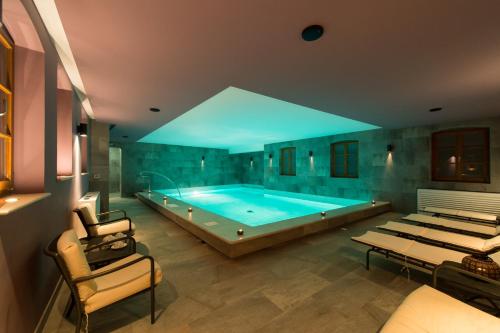 a large bathroom with a large swimming pool at Boutique Hotel Vela Vrata in Buzet