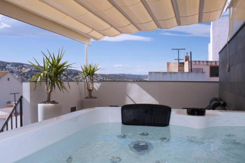 a jacuzzi tub on a balcony with a view at La Sepia Boba (Adults only) in Peñíscola
